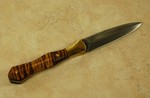 Dagger with double hamon lines on both sides of the blade, nice leather sheath too.