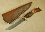 Very subtle damascus, slender and long knife.  Antler and stacked leather washer handle.