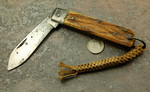 Was advertised as a WWII Folding Knife.  Jigged bone scales appear to be early (post WWII) Japanese style jigging; iron bolsters.  Braided nylon lanyard looks alot like orange nylon shot line, used by the Navy and Coast Guard in their Line Throwing Guns.  Probably belonged to a sailor in the 60s-70s.  It could be yours for:

$40