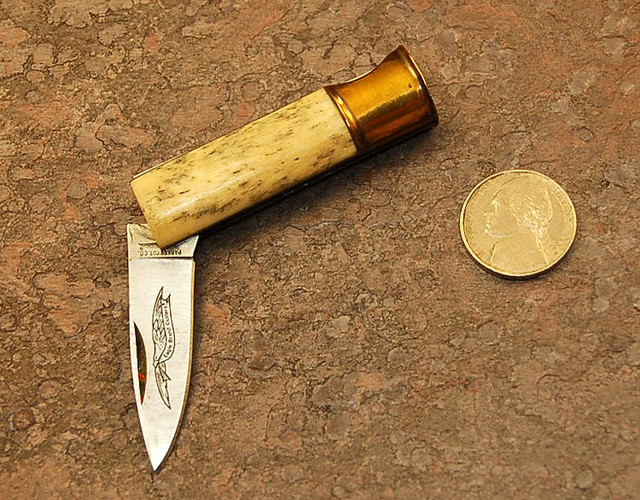 Parker small shotgun shell knife.  Bone scales, nice little knife, not the greatest bone though.

$20