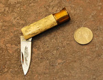 Parker small shotgun shell knife.  Bone scales, nice little knife, not the greatest bone though.

$20