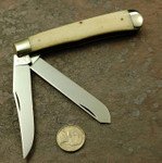 Queen large white bone trapper. 1990's knife; good solid bone for scrimshaw.

$50