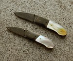 a pair of Peter Marth patent pending fancy assisted openers $1,200.00 for both