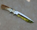 Bill Johnson recurve fighter, mammoth ivory bark handle, mirror polished blade.  Knife is perfect.  Bill has been making knives for over 25 years.  $650