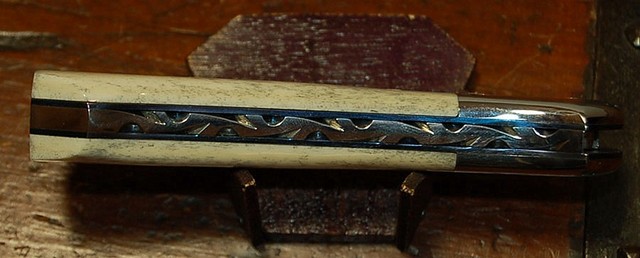 closeup of Ed Kalfayan folding dagger filework